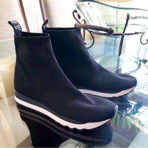 Ribbed collars and sock-savvy style sleek sporty look in the sneakers by DKNY